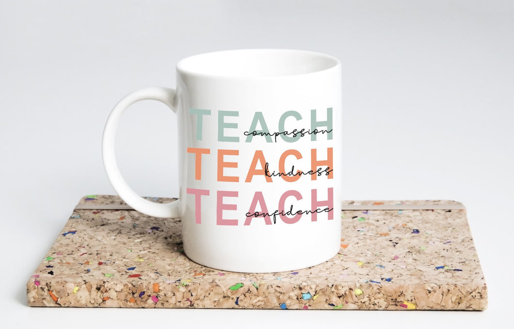 TEACH COMPASSION MUG